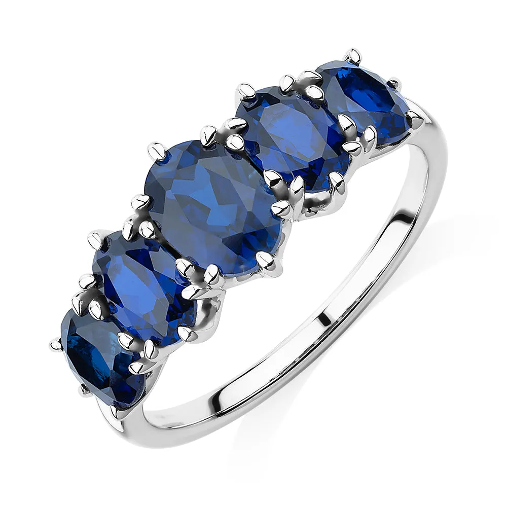 Dress ring with sapphire simulants in 10 carat white gold